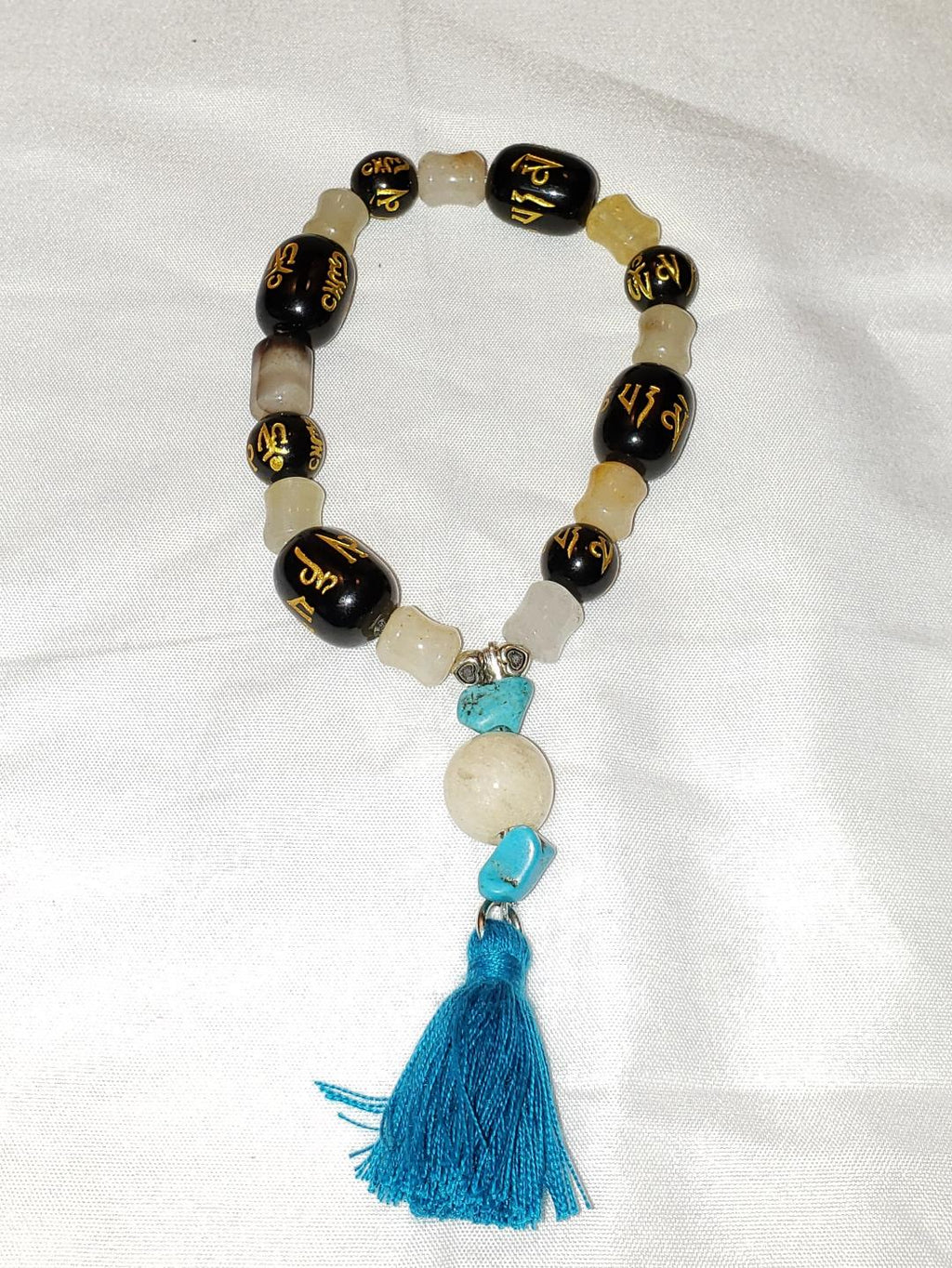 Onyx, white jade, turquoise Buddha bracelet with tassel